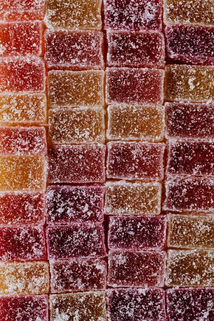 Close-up of colorful sugar-coated candies in a vertical arrangement.