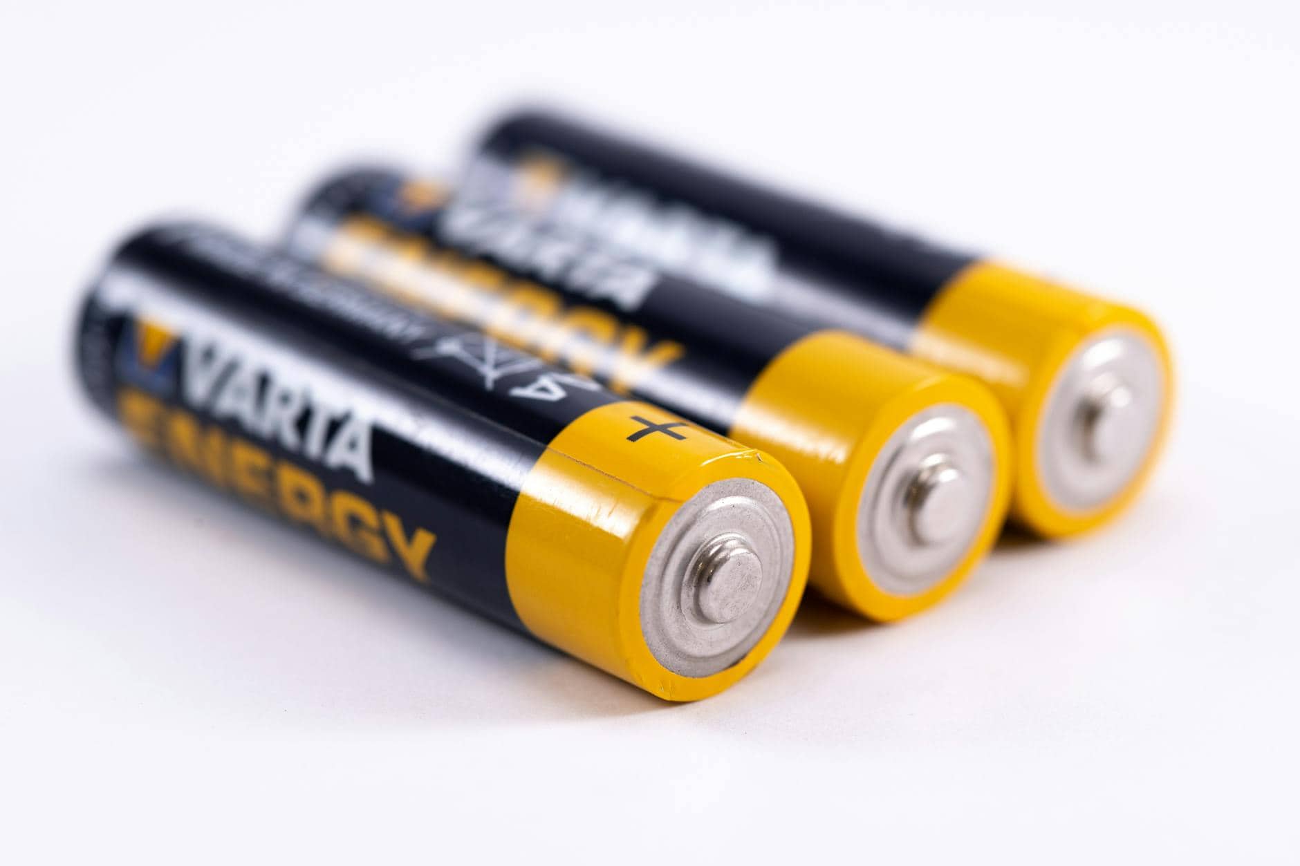 close up shot of black and yellow batteries