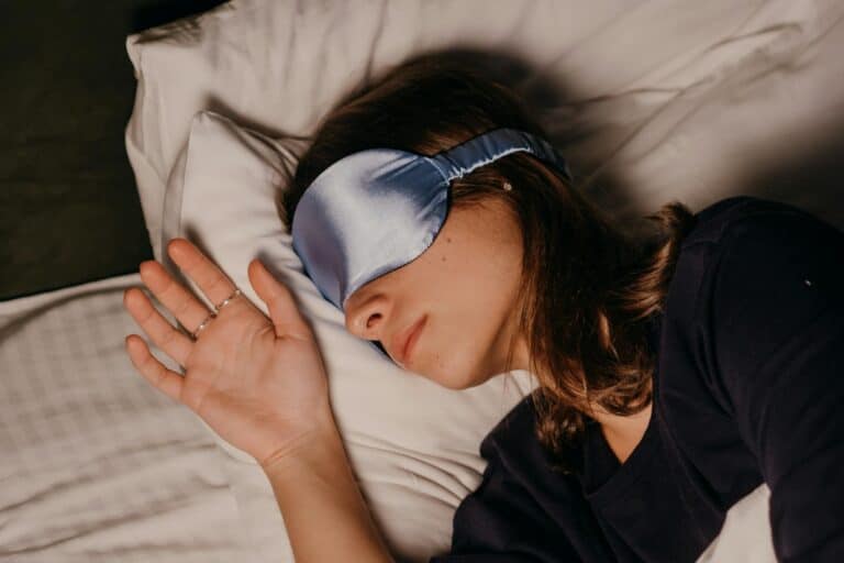 a woman wearing a sleep mask